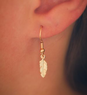 Golden metallic feather earrings.