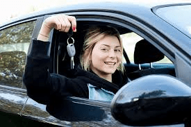 girl holding car keys