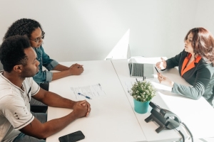 Couple consulting a financial advisor.