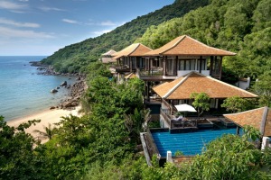 A villa near a beach with a big swimming pool