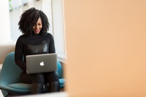 Picture of a person using a laptop to negotiate property prices in Jamaica