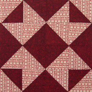 Red patterned star on darker red background