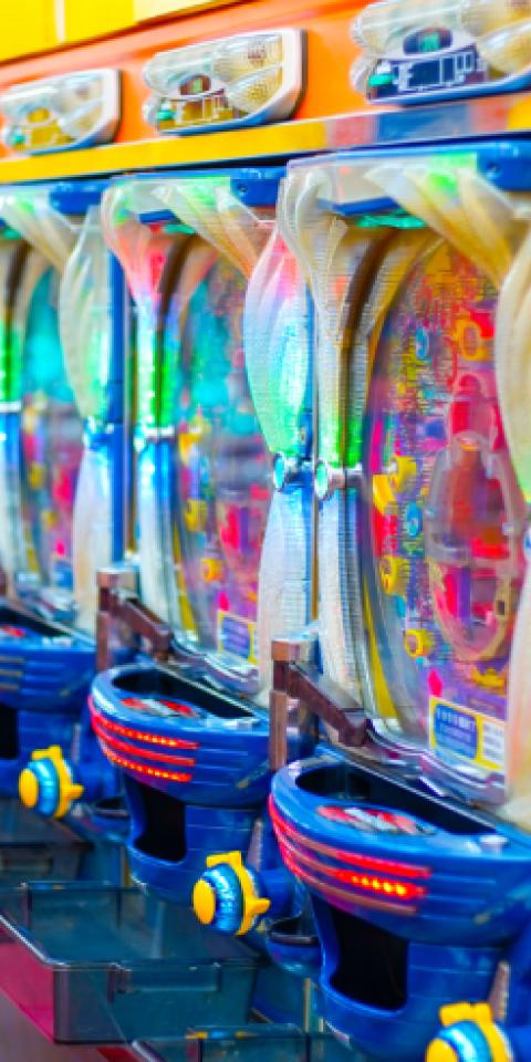 How do Pachinko machines create a sense of adventure?