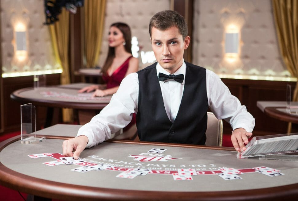 What equipment does a croupier use during games?