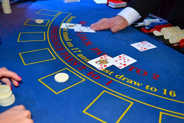 How does a croupier handle bets and payouts?