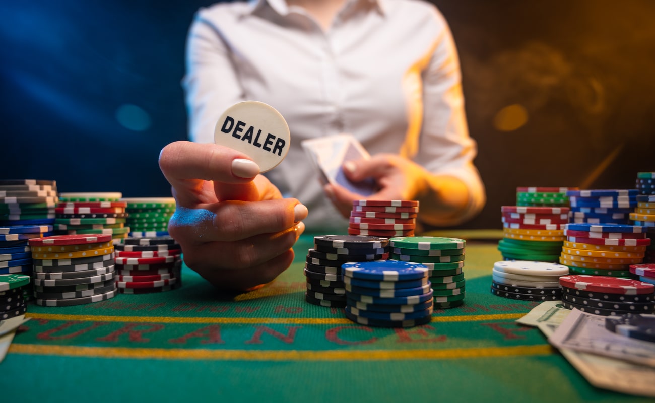 Are croupiers responsible for handling chips and cards?