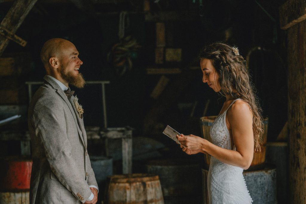 Moody Norway elopement on Senja Island. Reading your vows. By Christin Eide Photography.