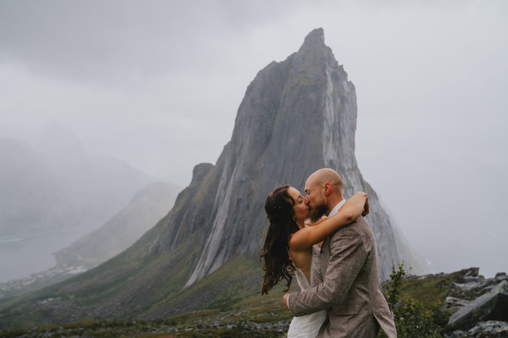 Moody Norway elopement on Senja Island. Rain adding to the mysterious vibe. By Christin Eide Photography