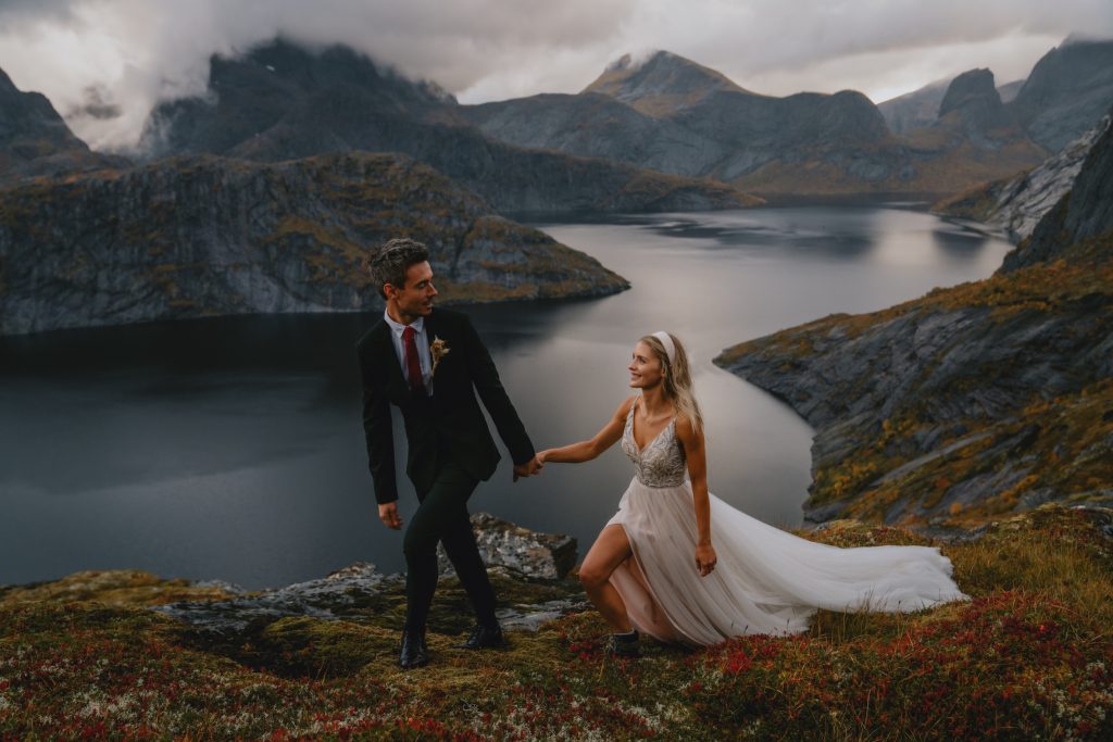 Happy in love hiking in Lofoten Norway. By Christin Eide Photography