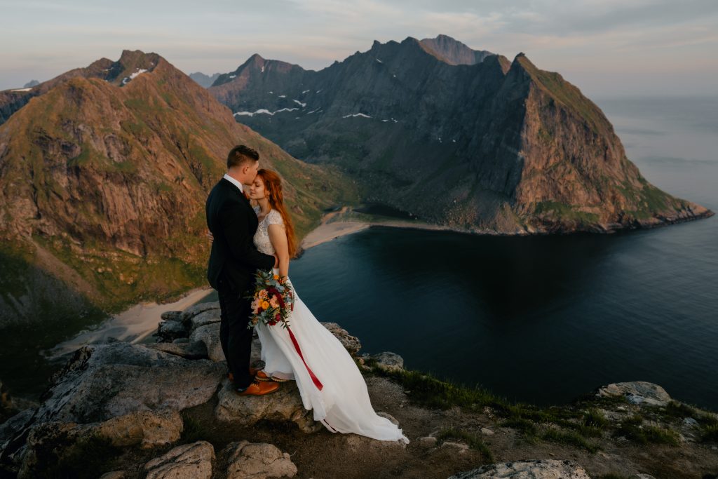 Hiking midnight sun elopement in Lofoten Norway. By Christin Eide Photography