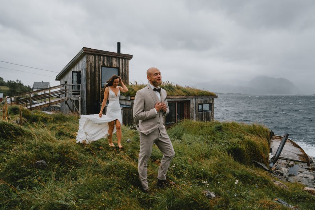 Stormy first look during hiking elopement in Senja Norway. By Christin Eide Photography