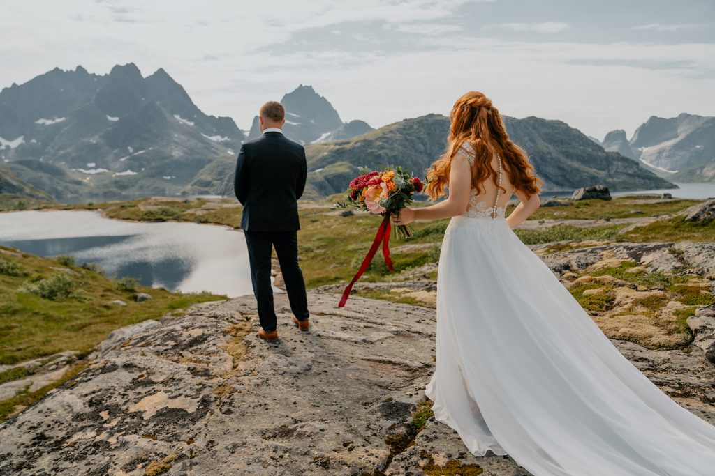 Bride on a mountain hike elopement. By Christin Eide Photography