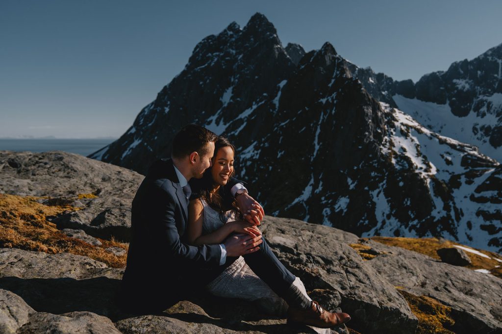 Winter elopement in Lofoten. Mountain cuddles. By Christin Eide Photography