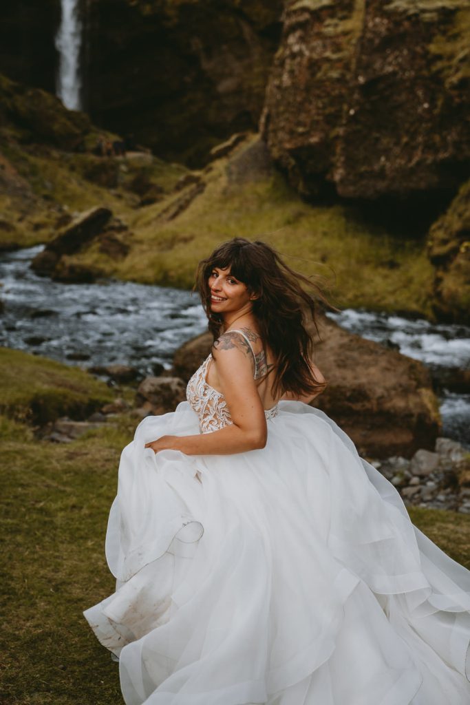 Beautiful bride running during elopement in Iceland, photo by Christin Eide Photography