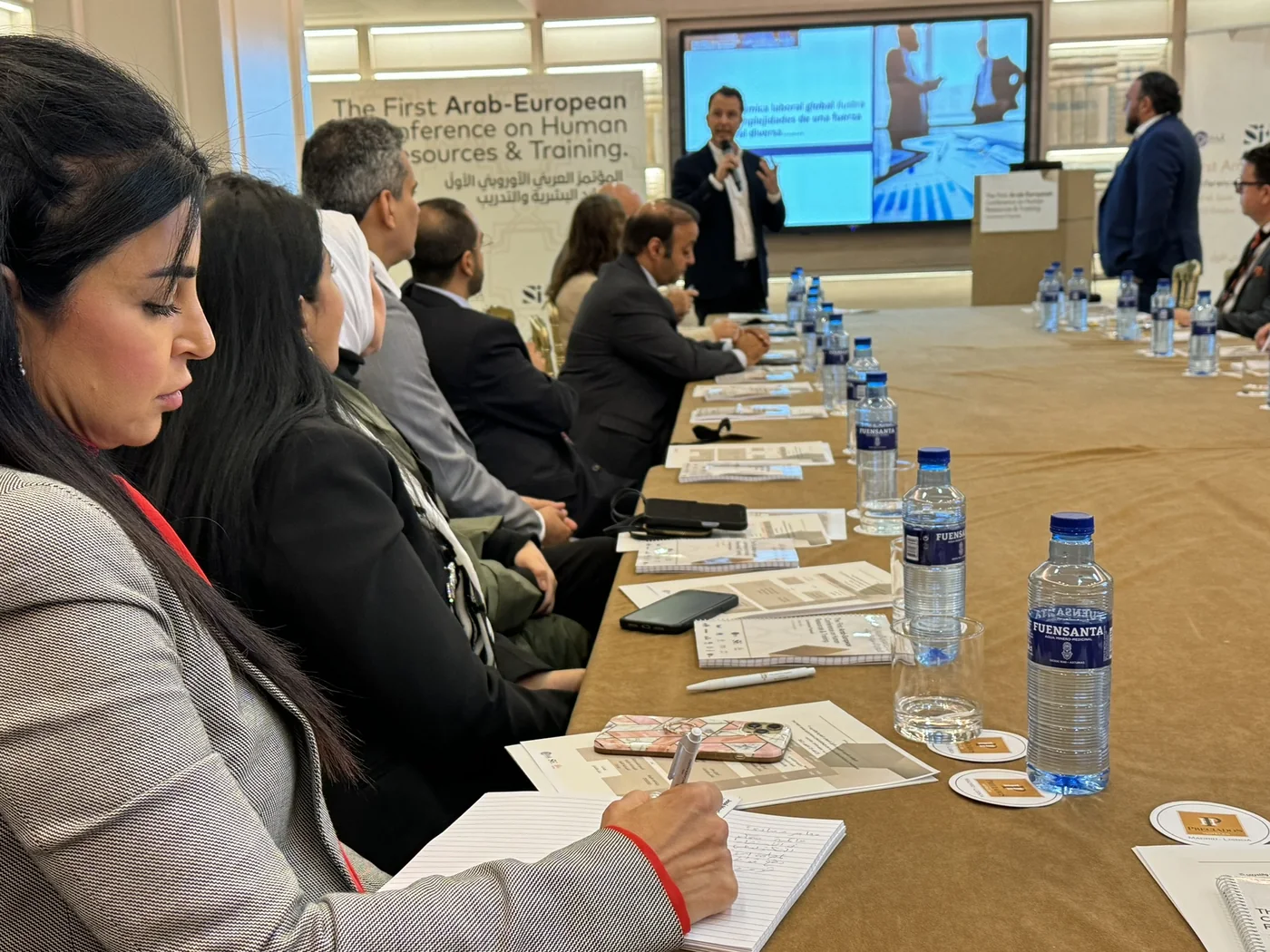 Participants attending a presentation at an Arab-European conference