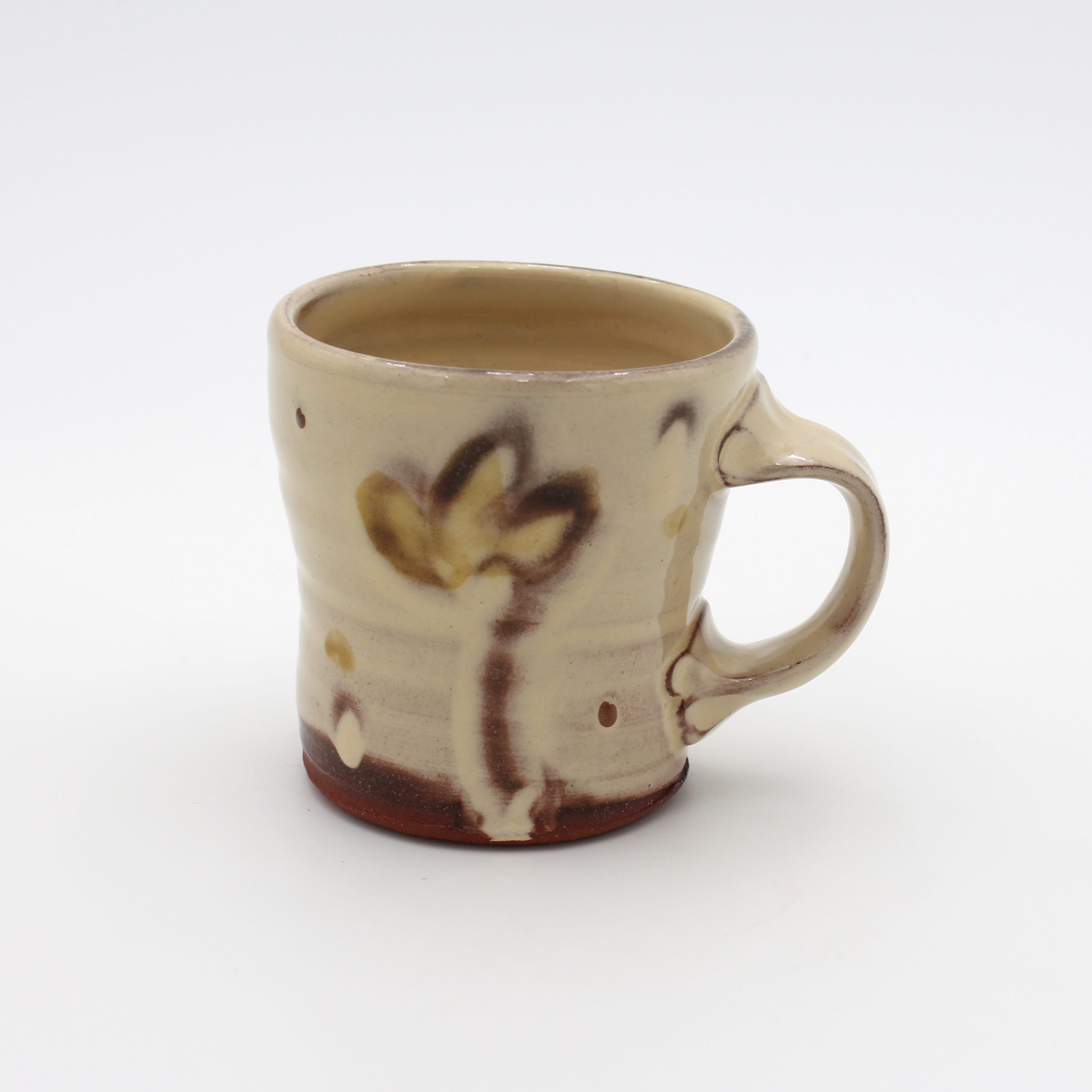Cream mug with flower motif by Frances Savage