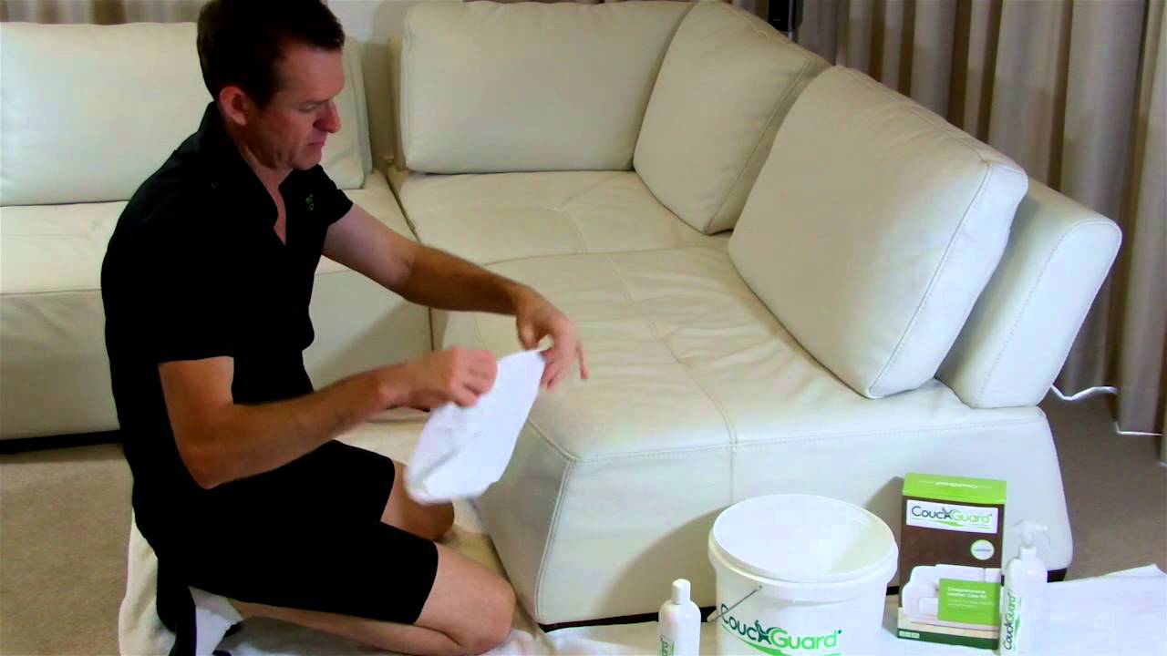 man-cleaning-leather-sofa