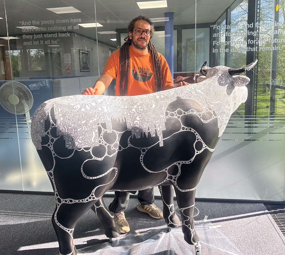 Multimedia artist Rawz with the ox he created for the SSL lobby.