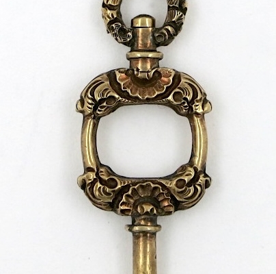 Gold pocket watch key