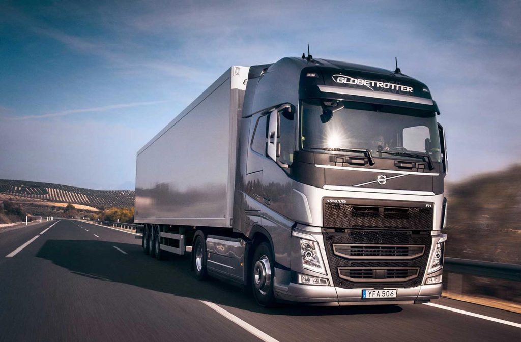 volvo truck driving on a highway