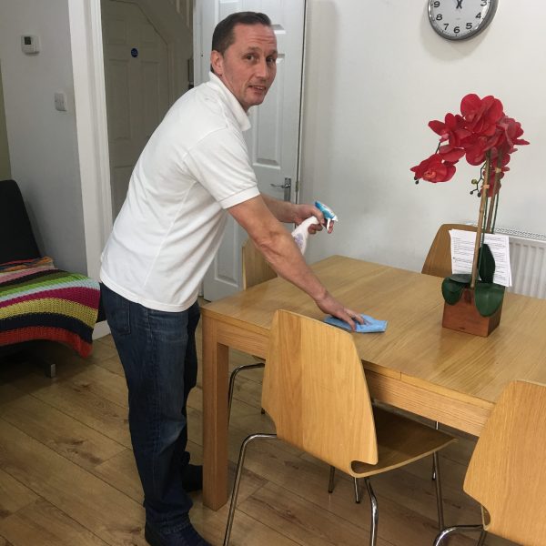 Service user doing house chores.