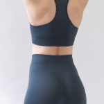 Racerback green sports bra with seamless construction for a comfortable fit