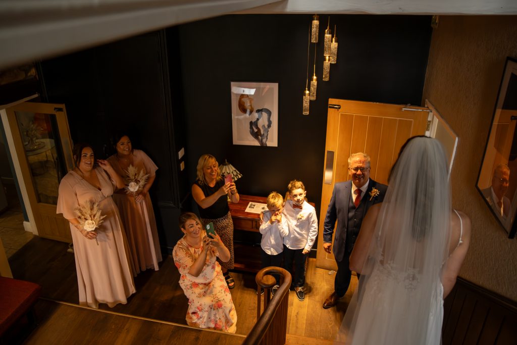 Photo of the Father of the Bride greeting his Daughter before the wedding at Gellifawr Woodland Retreat