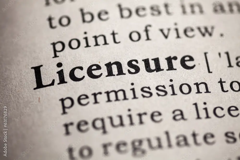 Close-up of dictionary definition of the word 'Licensure' highlighting its meaning