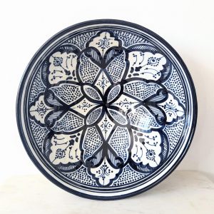 Large Moroccan ceramic bowl with intricate blue and white geometric patterns, hand-painted in a traditional style. The bowl has a wide, and deep shape, perfect for serving food or as a decorative centerpiece.