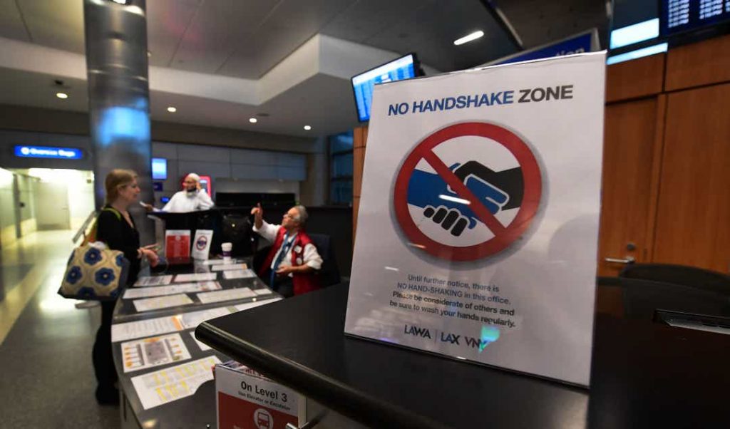 Notice on no handshake zone, to protect employees at Los Angeles International Airport.