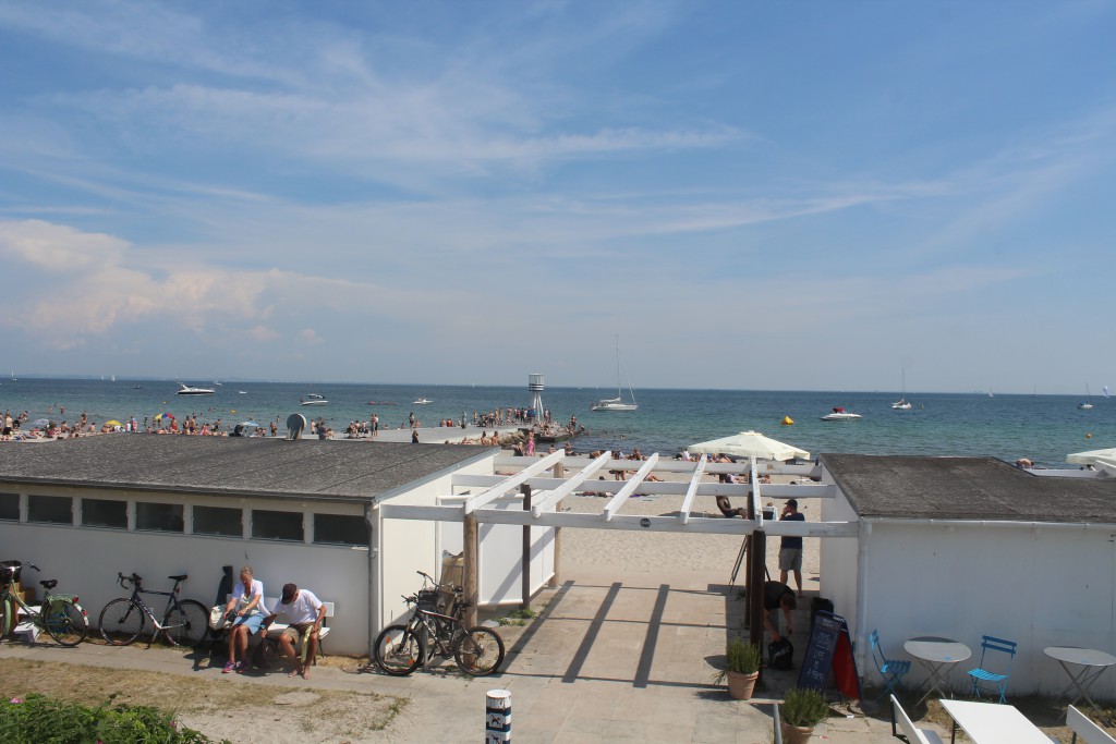View to Bellavue Beach with original lifeguard towers, kiosk and sture buildings designed by architect Arne Jacobsen in 19