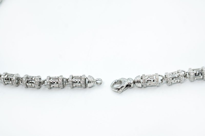 Luxury iced-out silver baguette tennis chain necklace with VS diamonds by DC Jewellers.