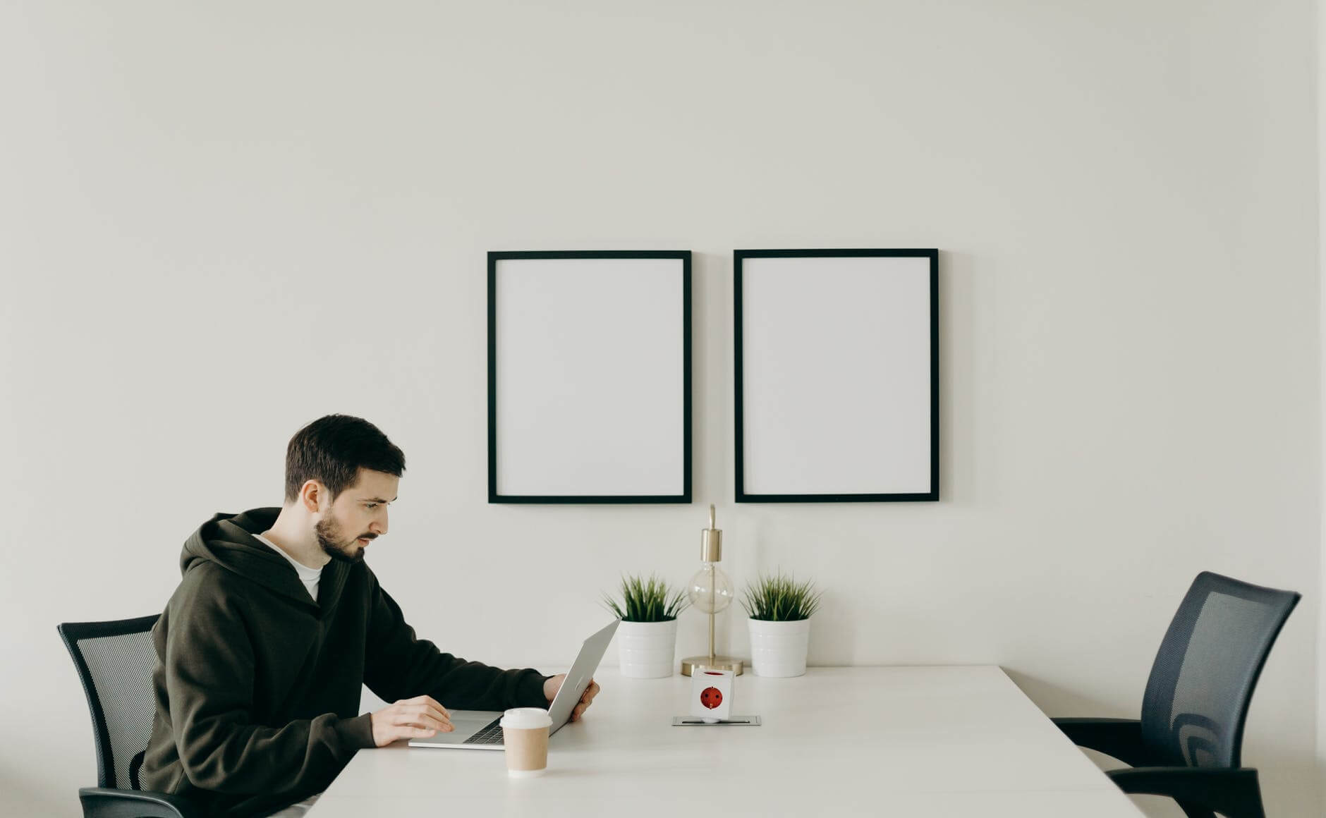 man in black long sleeve shirt sitting at table