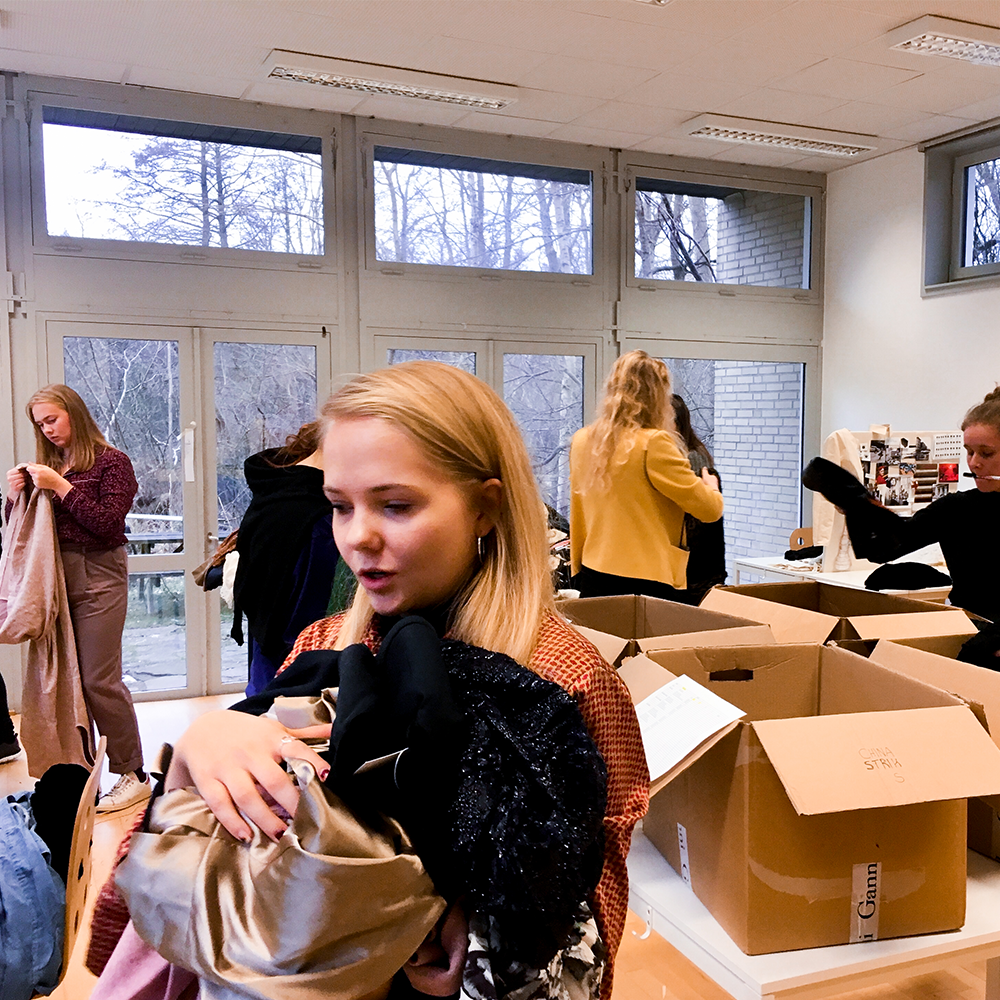 Fashion students in Copenhagen pack the donated clothing for the Fashion Fundraiser event in South Africa