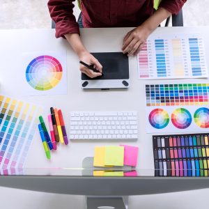 Image of female creative graphic designer working on color selec