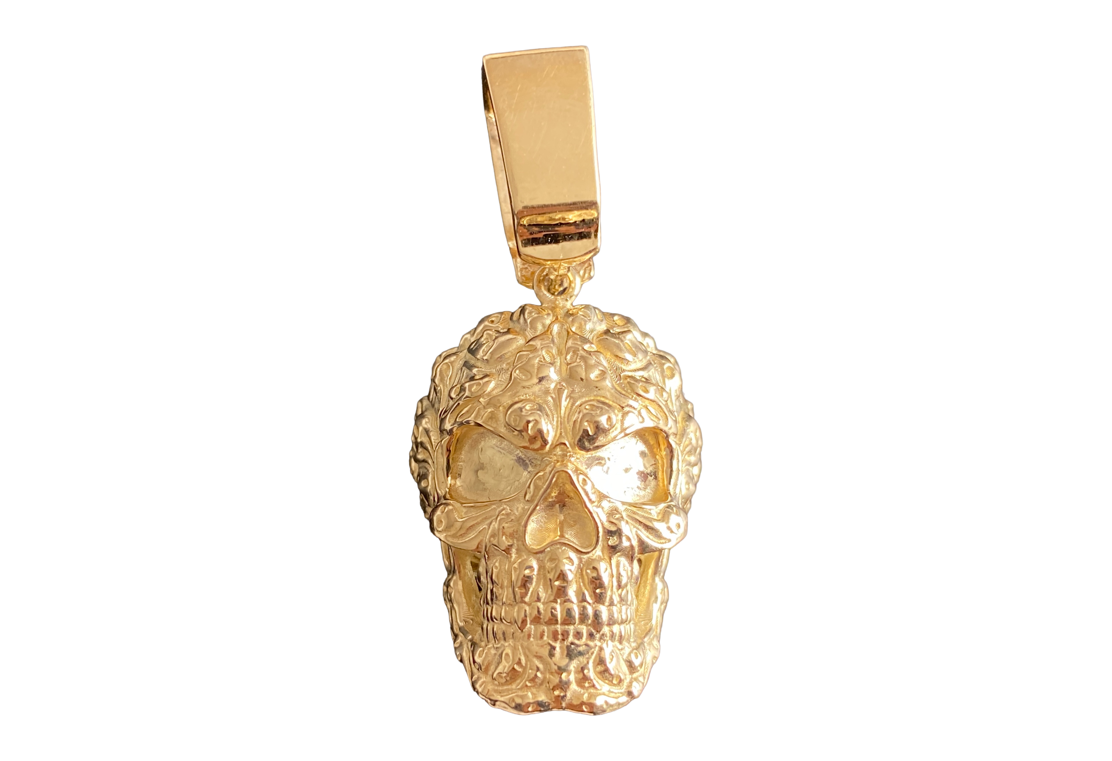 9ct Gold Patterned Skull Pendant — Hand-Finished British Hallmarked Jewellery 9ct Gold Patterned Skull Pendant — 8.7 g solid 9ct gold, Birmingham hallmarked with 13.1 × 8.4 mm bail