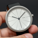 holding minimalist watch in your hands