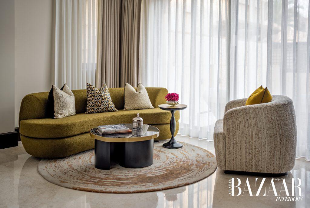 Magical Moments: Inside Jumeirah Dar Al Masyaf ’s Newly Revived Malakiya Villas 23 Gracefully structured furniture invites repose while the patterned rug nods to organic influences