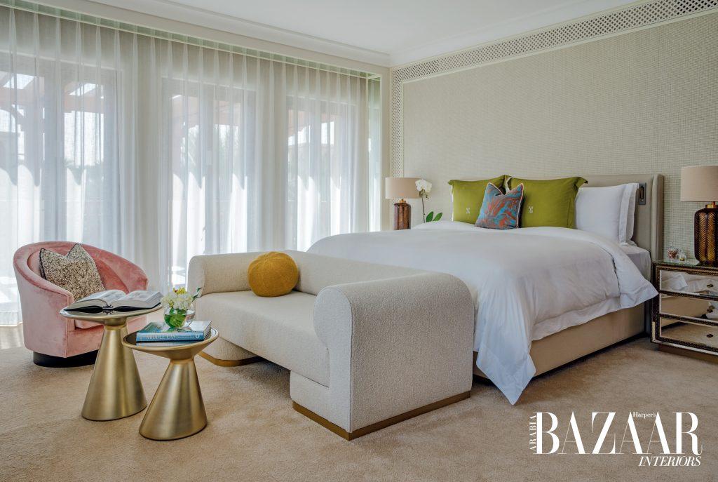 Natural light streams through the large windows and sheers illuminating the serene colours in the bedroom upstairs, accented with bright pops of green and pink