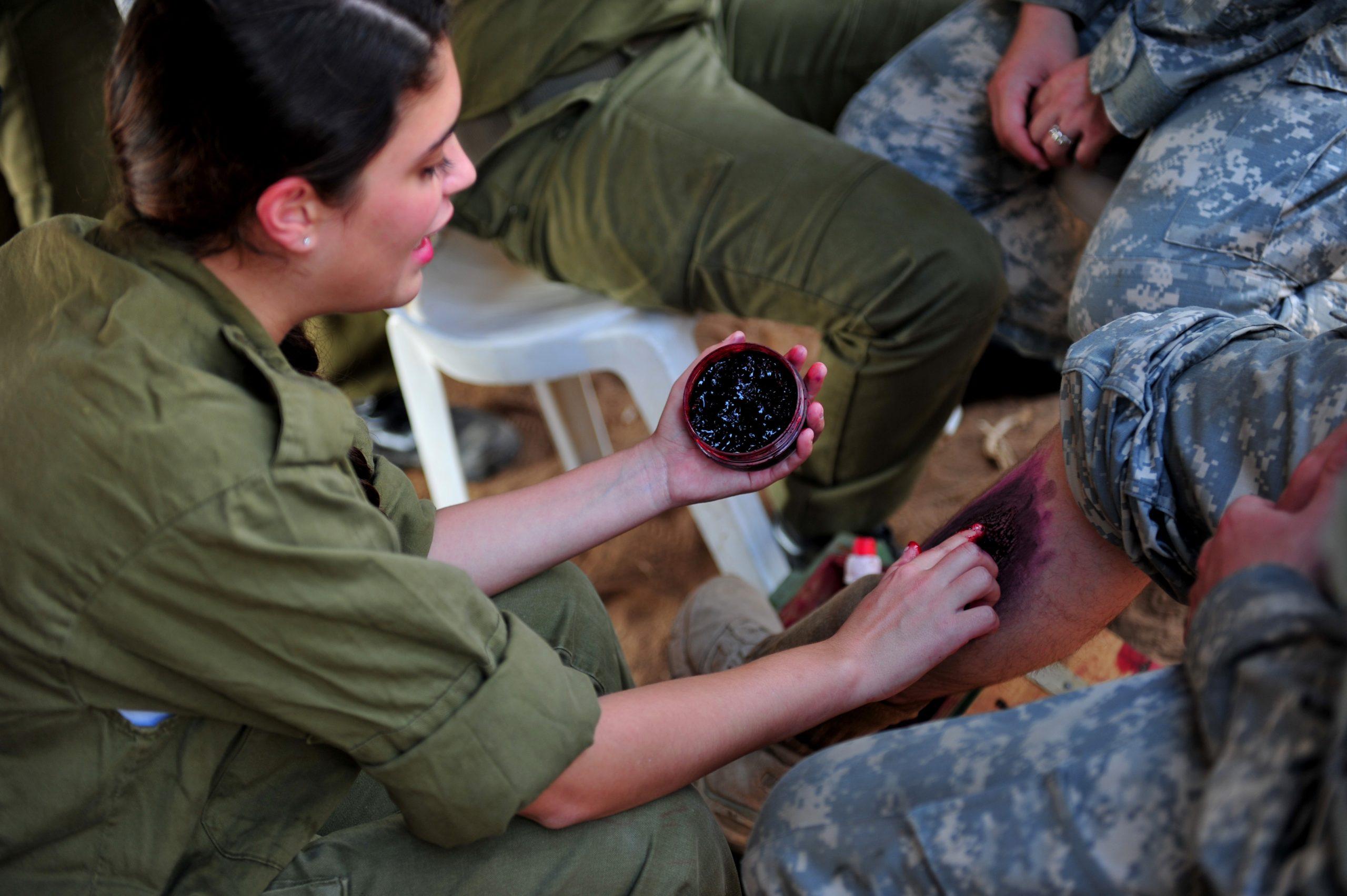 File:An Israeli soldier, left, applies makeup to simulate wounds on a U.S. Soldier for his role in a medical exercise for Austere Challenge 2012 in Beit Ezra, Israel 121022-F-QW942-025.jpg - Wikimedia Commons