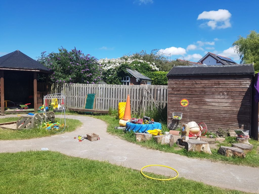 Our outdoor play area, complete with bug zone, gardening area, and more