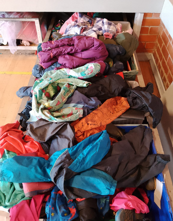 A large pile of splashsuits ready for use