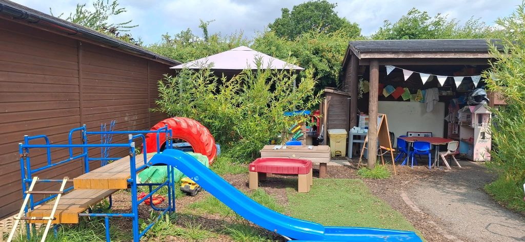 Dodleston pre-school outdoor area with gazebo and slide