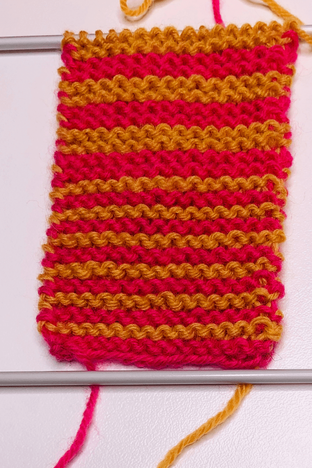 An example of how garter stitch stripes can look when you have control over the purl dash lines.