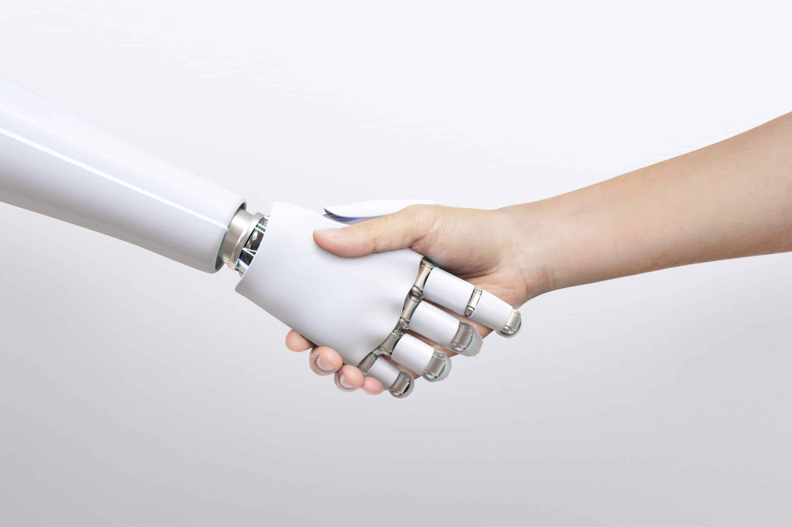 Robot and human shaking hands.