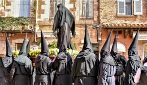 And men dressed in black signifying death, and carrying a statue of Jesus' mother