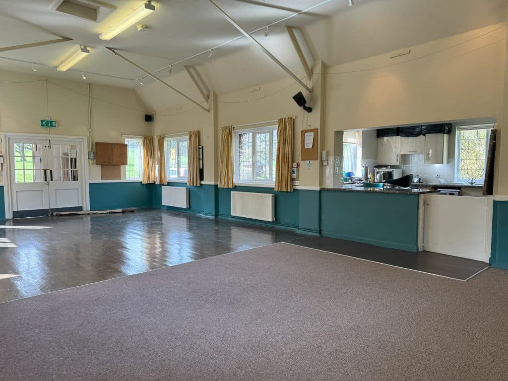 Inside view of East Tisted Village Hall - towards kitchen and front of hall.