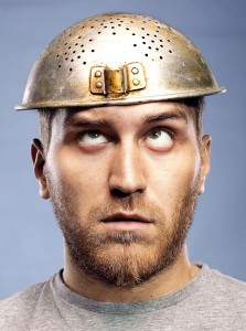 portrait of a man with a colander on his head