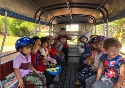 French International School kids riding in a local tuk tuk