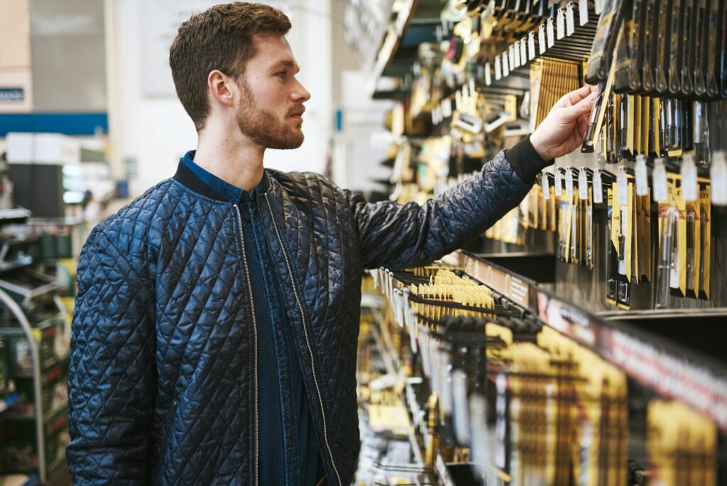 Bearded young man in a hardware store